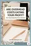 cozy maker desk with notebook and pen, text overlay Are Overhead Costs Eating Your Profit?