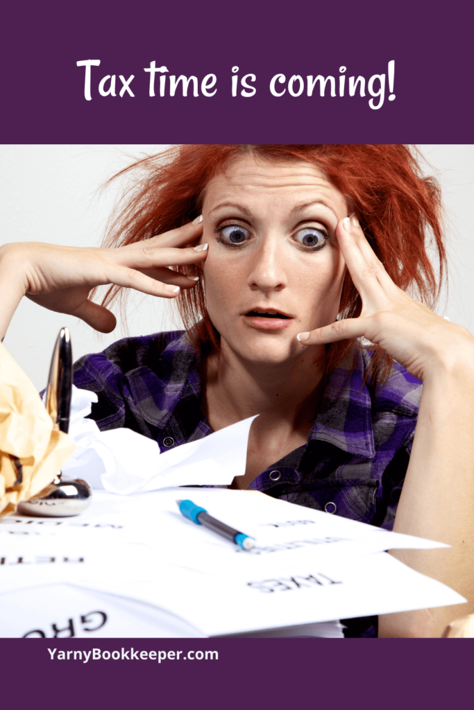 woman looking at a huge pile of bookkeeping paperwork feeling tax time panic