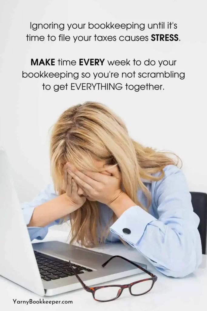 woman with head in her hands in front of a computer stressed about tax time